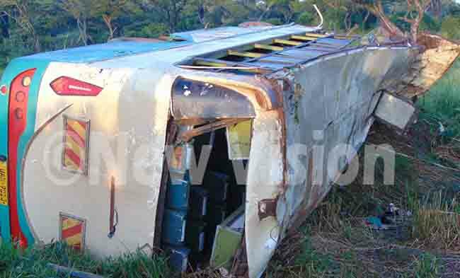   raveler bus which overturned living four dead on spot and 22 others rushed to iryandongo hospital with hoto by aidi ngola