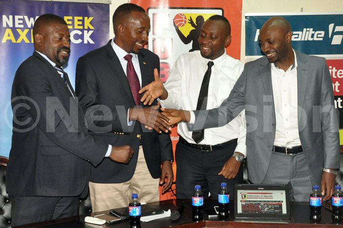  president mbrose ashobya 2nd left and official van tabazi shake hands with s ennis bidde left and hostalites regional manager ickson ushabe right after a press conference at  offices ay 5 2016 hoto by ichael subuga