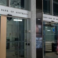 Australian central bank cuts interest rates for 1st time in over 4 years