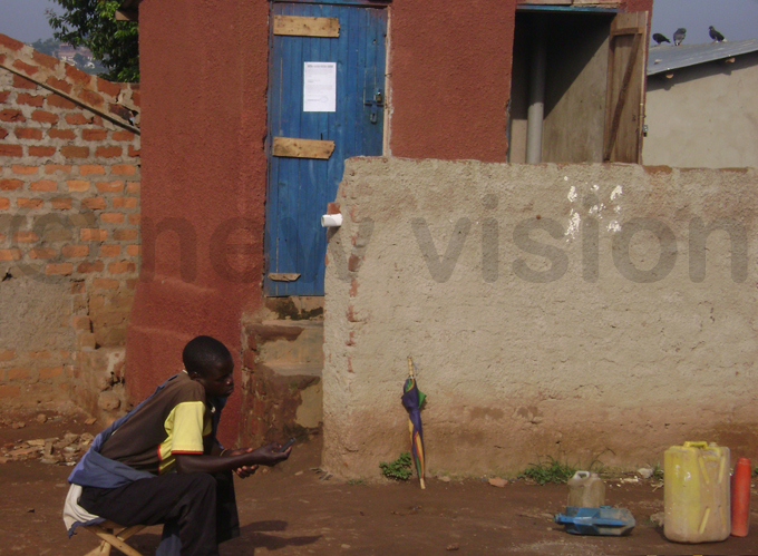 n attendant watching over a shared public toilet in anyogoga slum hoto by erald enywa