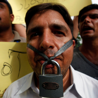 Pakistani journalists defy state censorship, slam "draconian" media gag laws