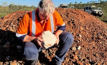 Kairos MD Peter Turner with a sample of the Lucky Sump spodumene 