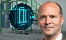 Hazer clears production hurdle: Managing director Glenn Corrie with the fluidised bed reactor at the heart of Hazer’s hydrogen technology.