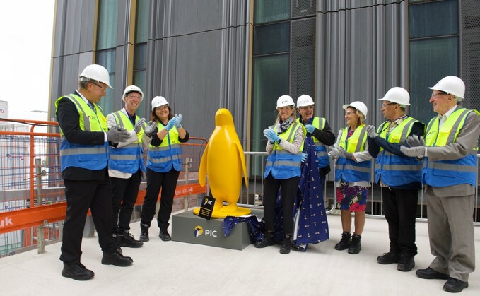 PIC chief executive Tracy Blackwell (centre right) at the topping out ceremony in Manchester