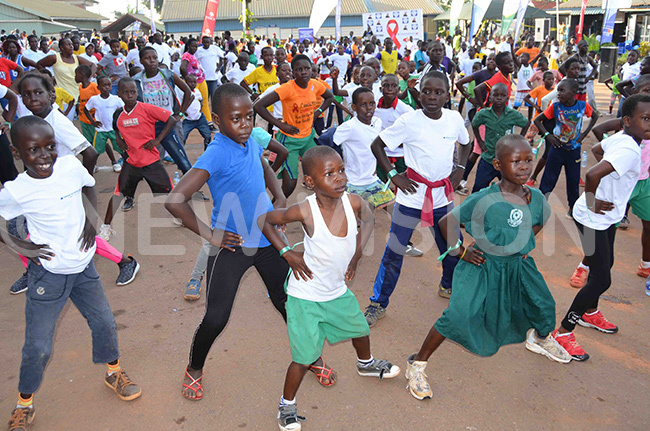  he children doing physical exercises in preparation for the charity run