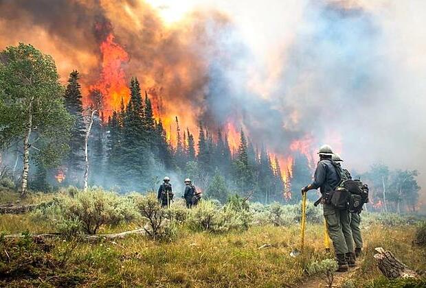 California's largest wildfire explodes as fires rage across US West