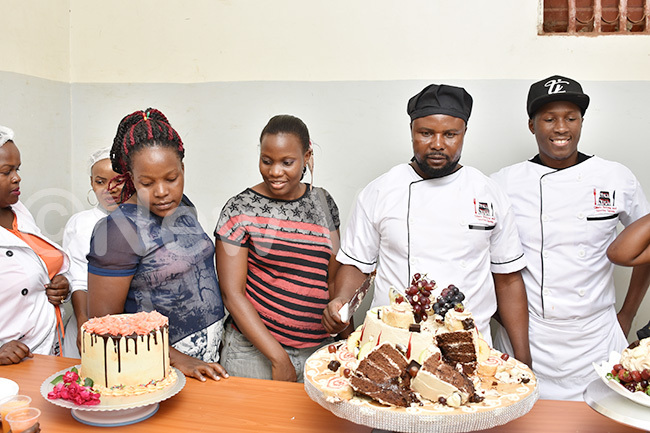  amuel wamusi cutting cake that he baked 