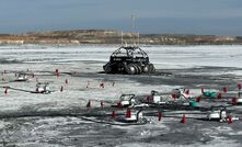 An Arca rover and measurement equipment on a tailings dam.