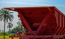 A freight train carrying bauxite in railway carriages in Kamsar, Guinea Credit: Shutterstock / Igor Grochev 