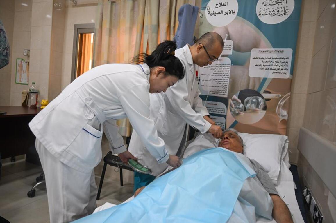Fine needles, warm hearts -- skilled acupuncture by Chinese doctors wins recognition in Kuwait
