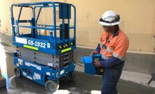  A worker "walking" a GS1932 scissor lift.