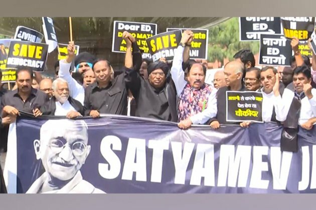 Opposition MPs march towards Vijay Chowk in black attire in a bid to show unity against Centre