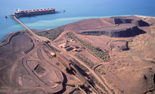 Loading iron ore on a ship at Dampier, Western Australia.