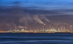 An oil refinery at night Credit_Shutterstoc/People Image Studio