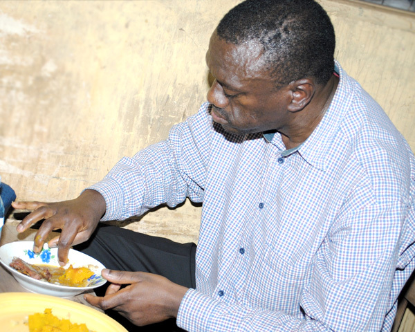 Besigye Eating