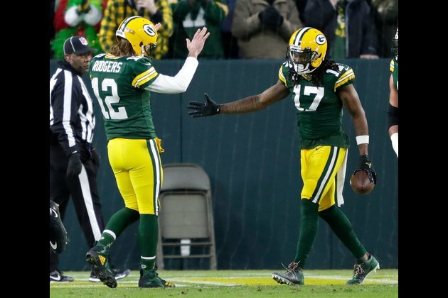 With franchise QB silent, Packers WR Davante Adams expects tag