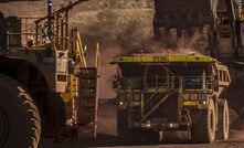 Two Cat 793F CMD autonomous trucks operating at Fortescue Metals Group’s Solomon Hub