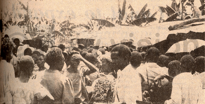 he scene outside anyongas house with frantic people milling about in the hope of getting the special soil ile hoto