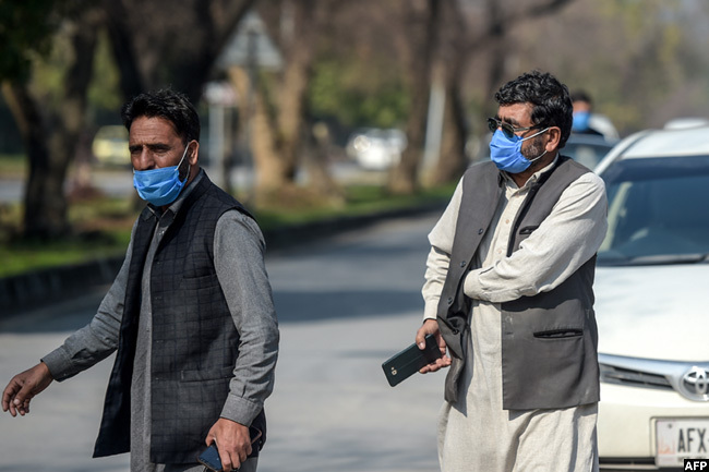  rivers who work for a akistanbased hinese company look on as they wear protective facemasks before their temperatures check in slamabad on hursday after instructions from akistani authorities to take preventive measures against the coronavirus