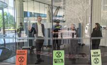  Protestors glued themselves to the lobby of Woodside Petroleum headquarters in Perth. ENB/Mark Tilly