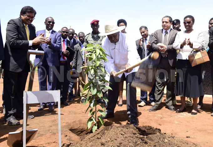  resident oweri useveni plants a tree as managing director  ahathi nfra ganda limited avi hankar left ike ukula 2nd left minister for energy ren uloni right and others cheer up during the ground breaking ceremony for the development of oil transportation system through ake ictoria 