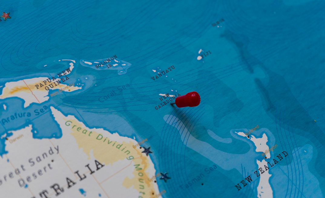 a pin on new caledonia in the world map