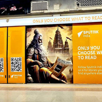 Sputnik India coils Delhi Metro's Yellow Line with their logos, slogans, and QR codes