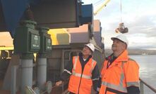 Paul Glover (left) and Leon Hawker inspecting a previous bauxite shipment at Bell Bay.