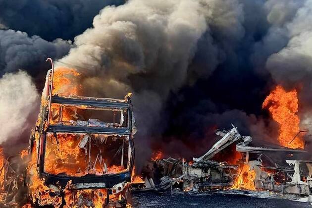 More than 30 double-decker buses go up in flames at depot as police launch arson investigation