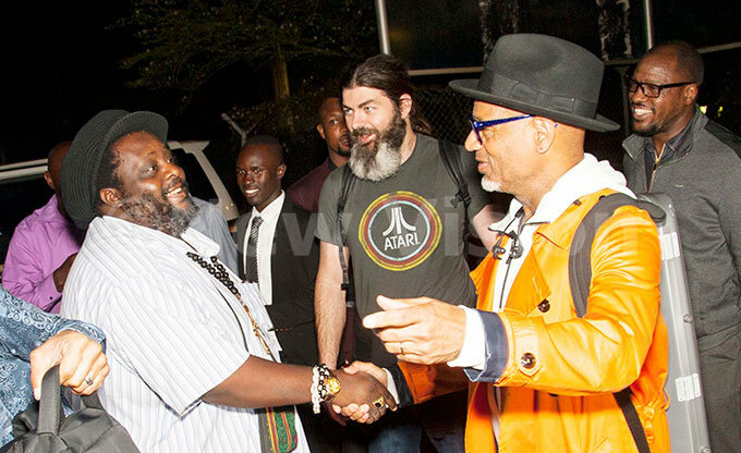  irk halum right greets gandan music promoter shaka ayanja after arriving at ntebbe on uesday night  hoto by alungi abuye
