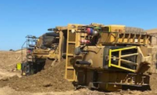  A loaded scraper has rolled onto its side while trying to traverse from a lower level bench up onto a higher level bench. 