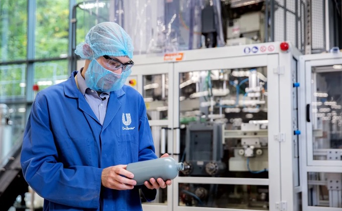 A Unilever packaging team member tests recycled plastic at the company's Advanced Manufacturing Center in Port Sunlight in the UK / Source: Unilever