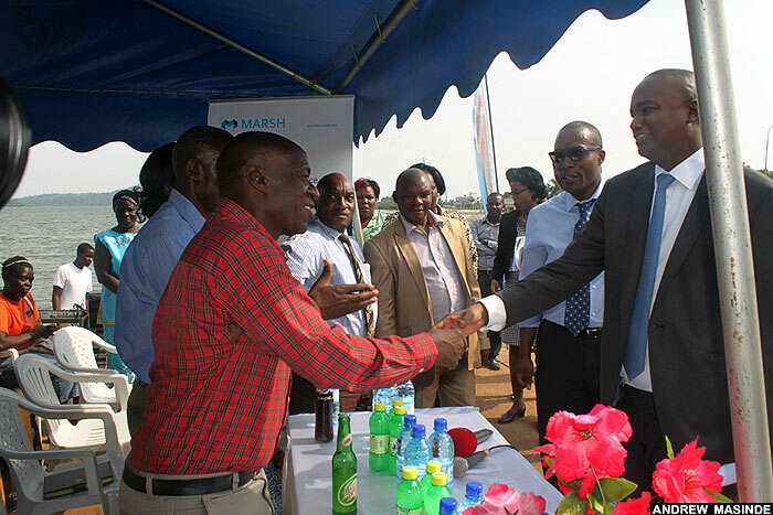  atrick weheire of stanbic ank ganda greets immy amya the vice chairman of aba landing site