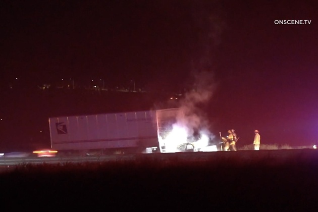 One killed in early morning crash with USPS truck