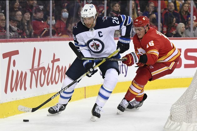 Jets rally with four unanswered goals to douse Flames