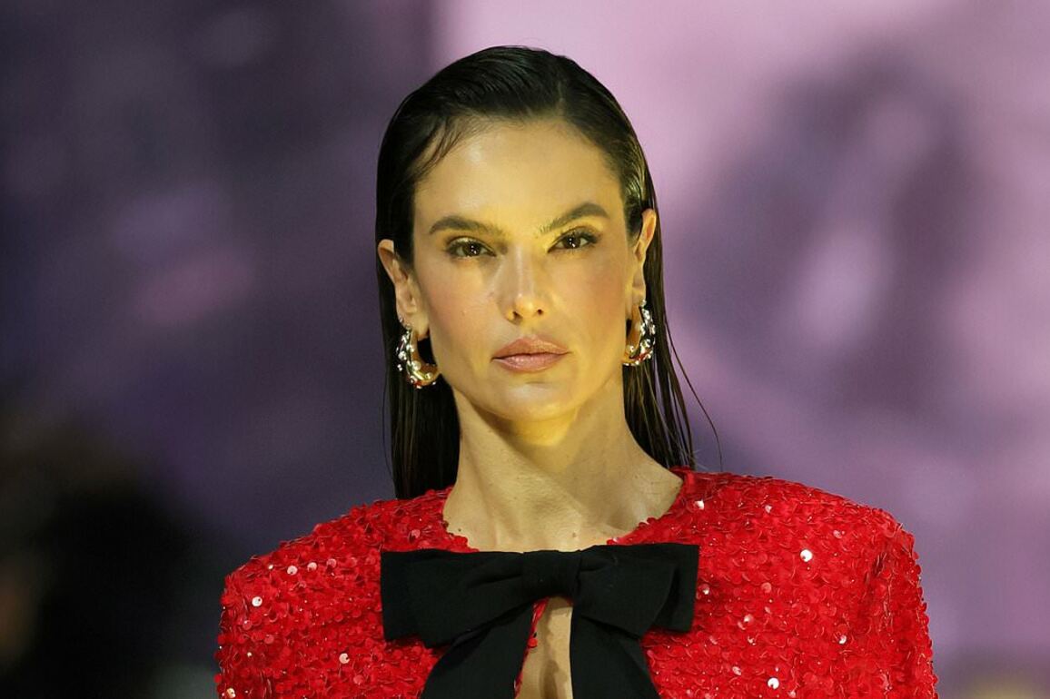 Alessandra Ambrosio storms the runway in red at the Marc Cain show during Berlin Fashion Week