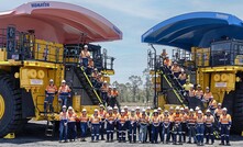 The trays of the trucks at the mine have been painted pink and blue. 