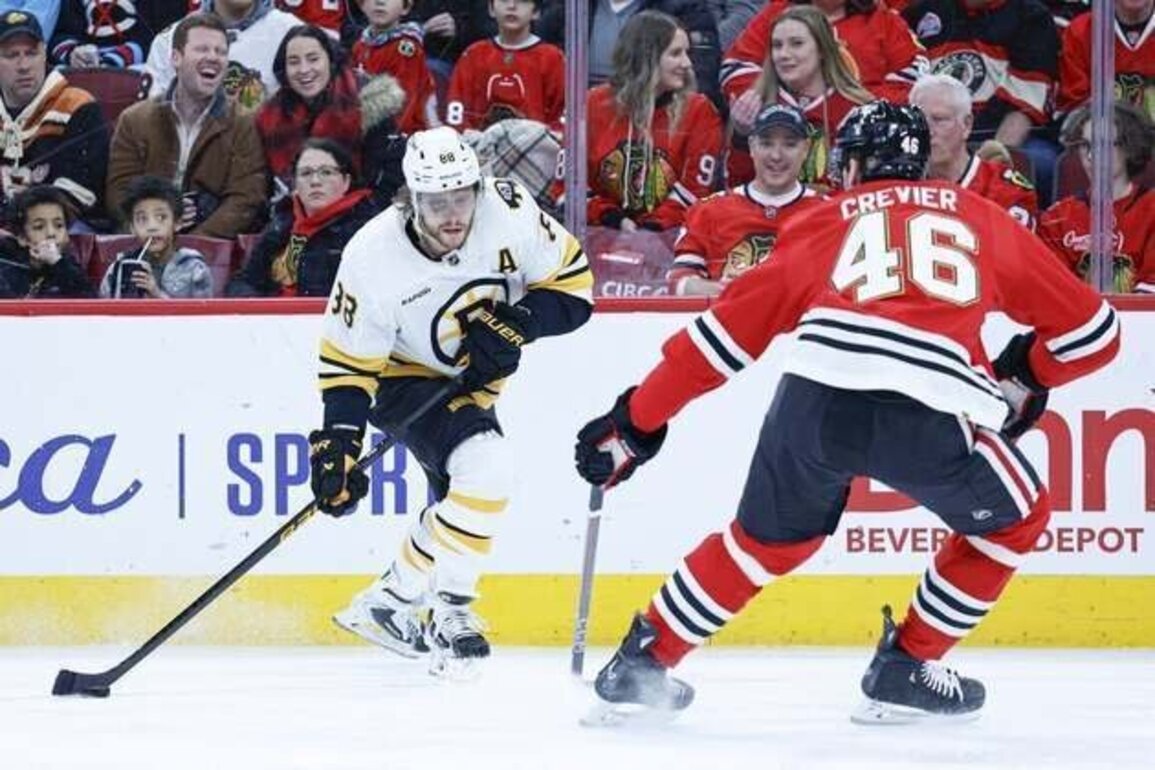 Bruins score 5 straight goals to overwhelm Blackhawks