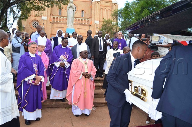ishop amiano uzzetti rchbishop ianco rchibishop wanga and other clerics leaving the cathedral with ishop sentongos casket after the requiem mass 