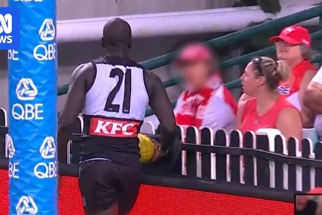 Sydney Swans fan throws cardboard sign at Aliir Aliir during Port Adelaide&#39;s AFL win