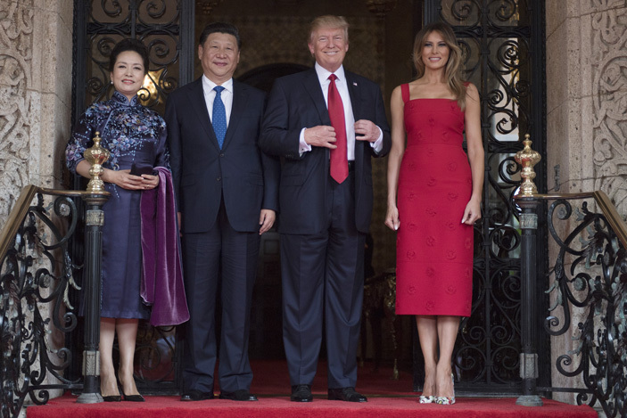 irst ady elania rump and resident onald rump 2nd pose with hinese resident i inping 2nd and his wife eng iyuan upon their arrival to the araago estate in est alm each lorida on pril 6 2017 hoto im atson