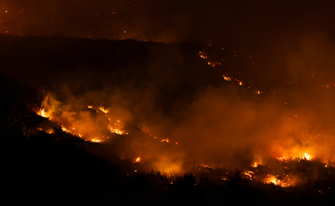 Wildfire blazes through the Ynysfeio Forest, above the Welsh village of Treherbert in the Rhondda Fawr valley in South Wales (Photo by Ryan Hiscott/Getty Images)
