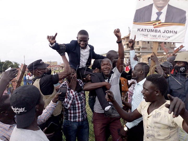 John Katumba  being lifted by his supporters 
