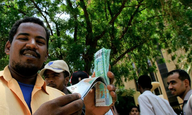 Sudan sharply devalues currency as economic crisis bites Sudan sharply devalues currency as economic crisis bites