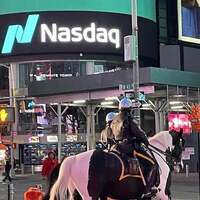Nasdaq Composite gains 0.35 percent in lackluster trading Friday