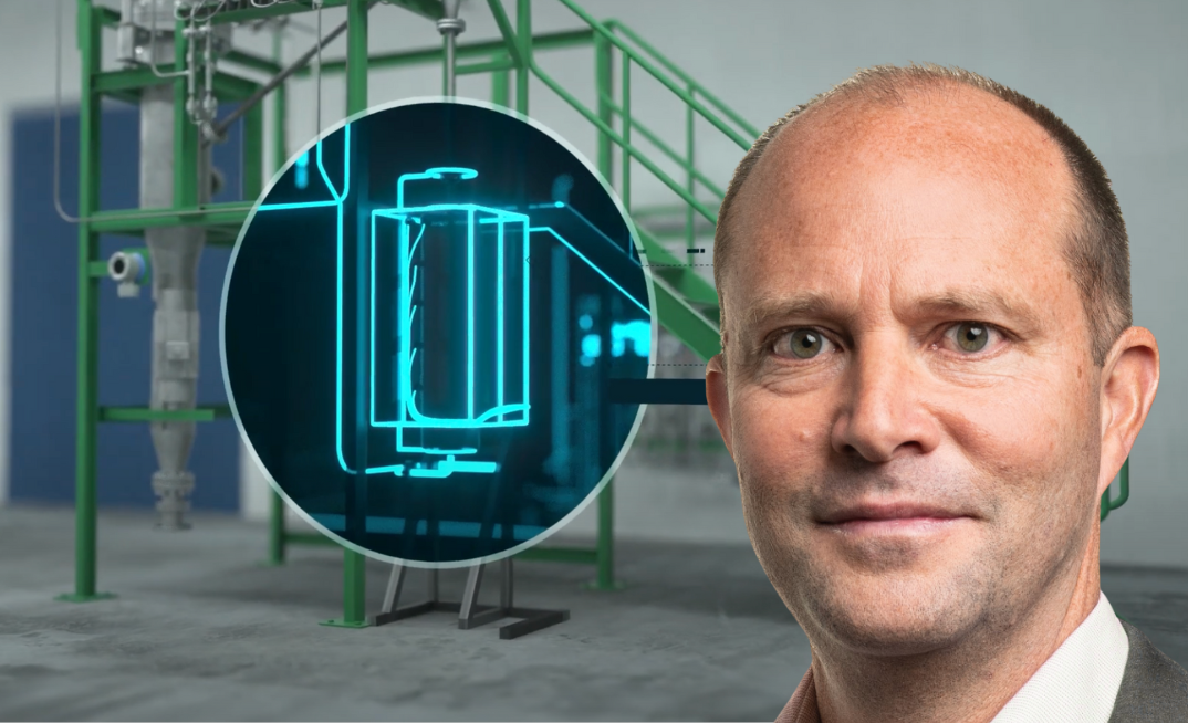Hazer clears production hurdle: Managing director Glenn Corrie with the fluidised bed reactor at the heart of Hazer’s hydrogen technology.