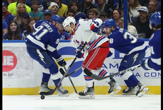 Artemi Panarin's hat trick powers Rangers past Lightning