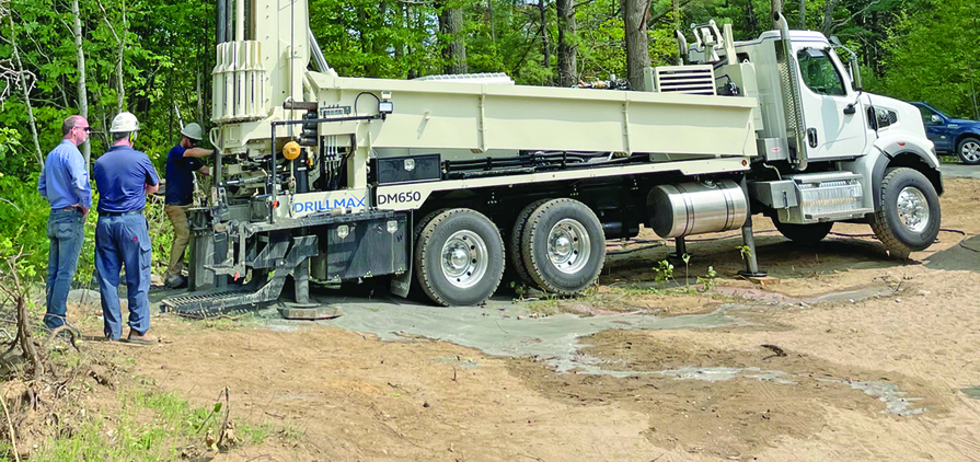 The Geoprobe DM650 air rotary drill rig provides time-saving features like backloading carousel and top head side shift