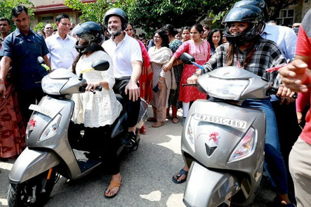 Rahul Gandhi rides pillion ongirl student's scooter in Jaipur