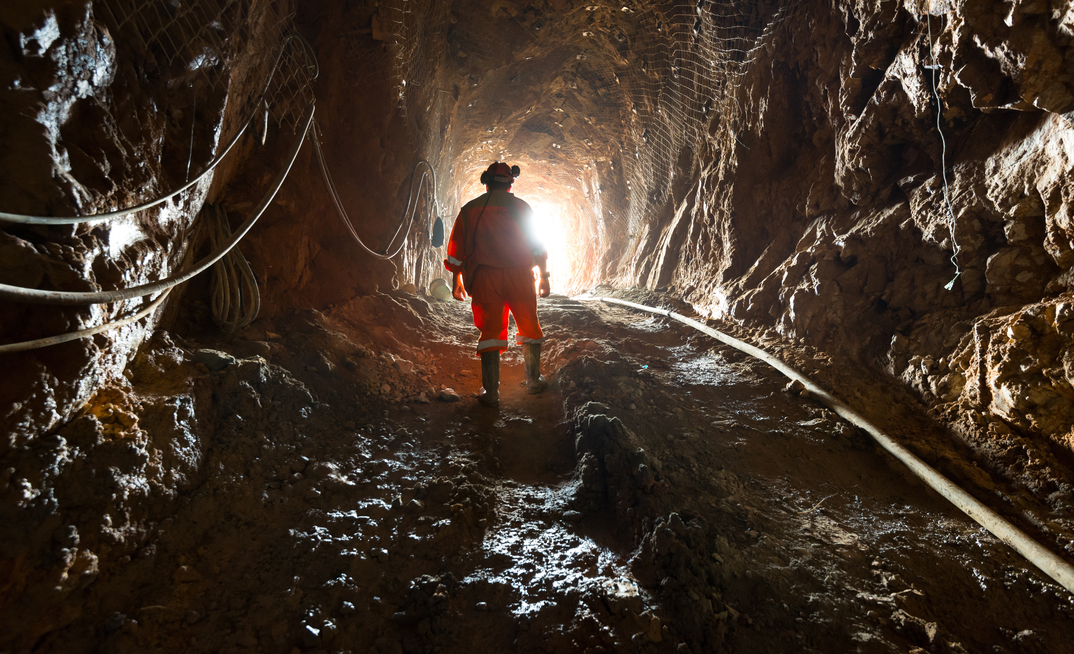  Miner inside the access tunnel of an underground gold and copper mine in Region del Maule, Chile